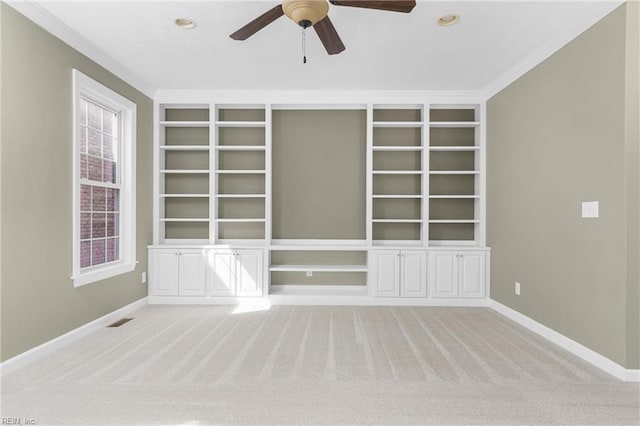 spare room featuring baseboards, carpet floors, and ceiling fan