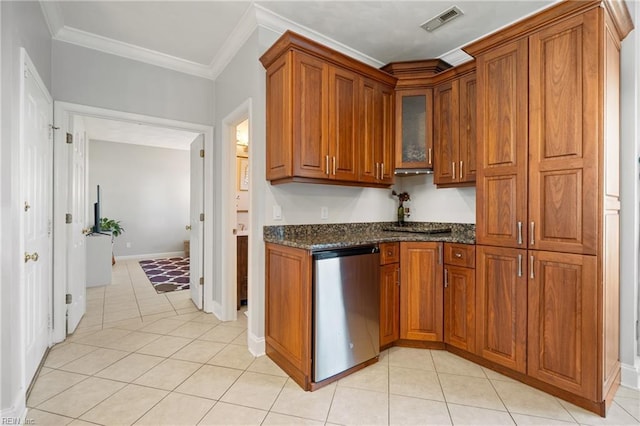 kitchen with visible vents, crown molding, glass insert cabinets, brown cabinetry, and stainless steel dishwasher