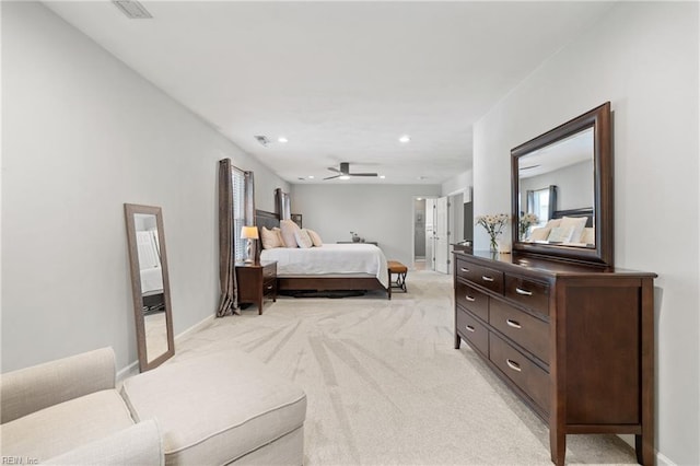 bedroom with recessed lighting, light colored carpet, and baseboards