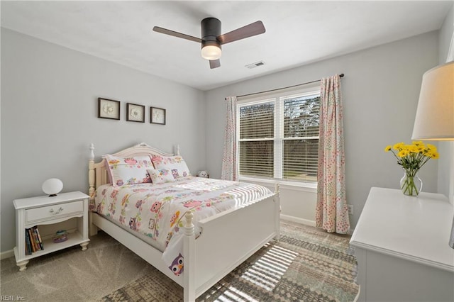 bedroom featuring carpet flooring, baseboards, visible vents, and ceiling fan