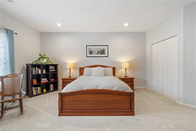 carpeted bedroom with recessed lighting, a closet, and baseboards