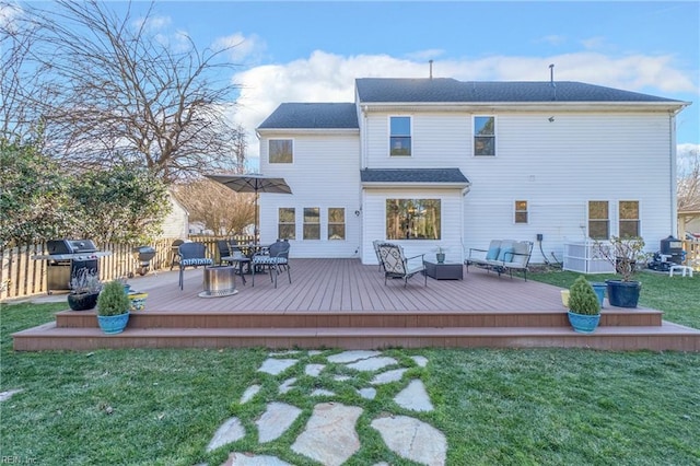 rear view of house featuring a yard, central AC, and a wooden deck