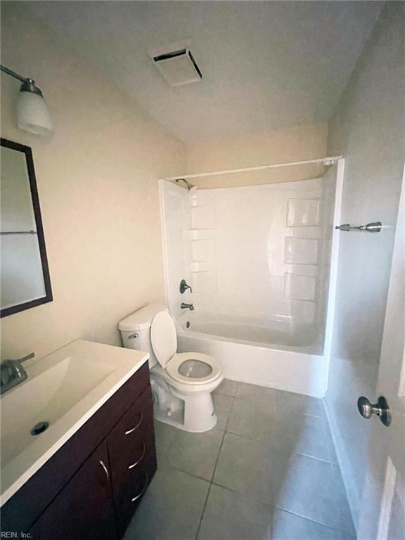 full bathroom with tile patterned flooring, visible vents, toilet, shower / bathing tub combination, and vanity