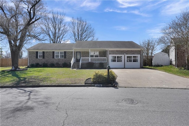 view of front of home with driveway, covered porch, a front yard, crawl space, and brick siding