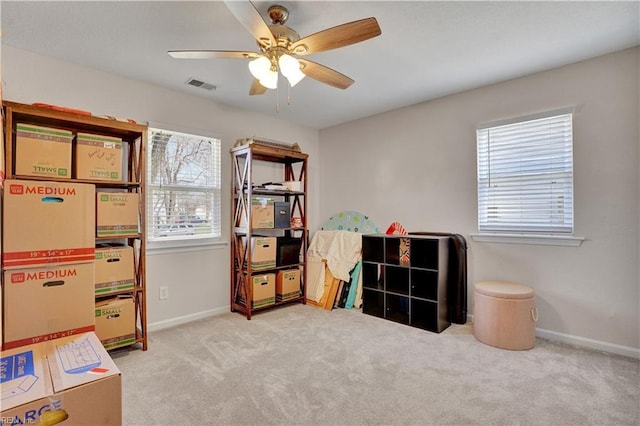 rec room featuring plenty of natural light, baseboards, visible vents, and carpet floors