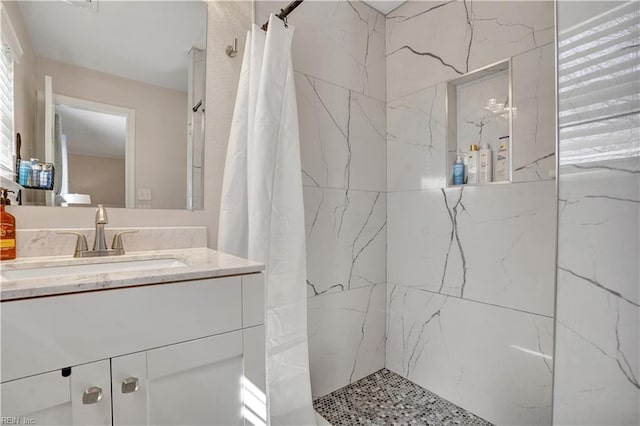 bathroom featuring vanity and a shower with curtain