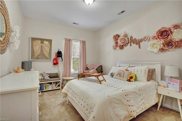 bedroom featuring visible vents and light carpet