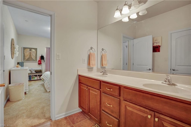 bathroom featuring double vanity, tile patterned flooring, and a sink