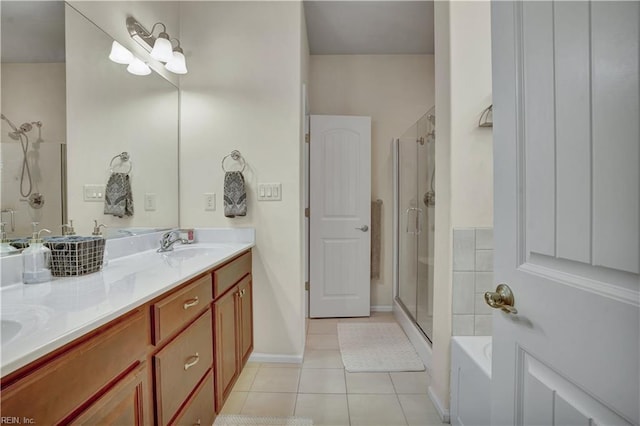 bathroom with a tub to relax in, double vanity, a sink, a shower stall, and tile patterned floors