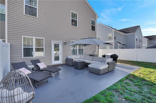 view of patio / terrace with grilling area, an outdoor hangout area, and fence