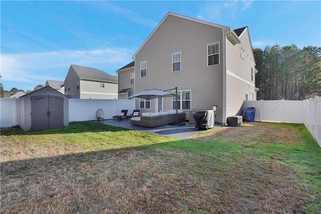 rear view of house featuring a storage unit, an outdoor living space, a fenced backyard, an outdoor structure, and a patio area