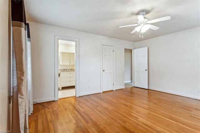 307 Ridgeland Dr, Smithfield, VA 23430 - unfurnished bedroom featuring a ceiling fan, baseboards, light wood-style floors, and ensuite bathroom