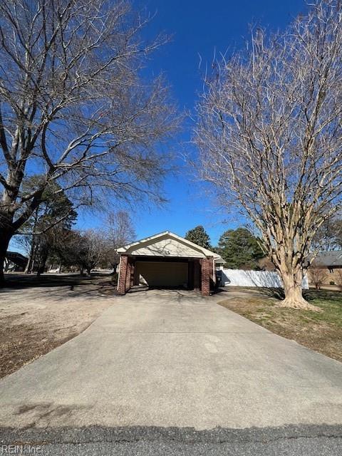 exterior space with concrete driveway