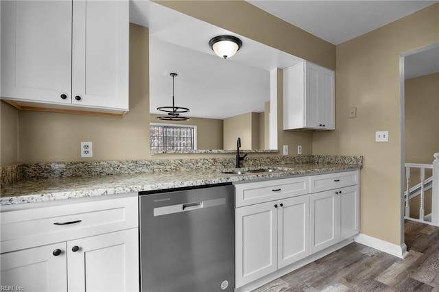 kitchen featuring a sink, wood finished floors, white cabinetry, light stone countertops, and dishwasher