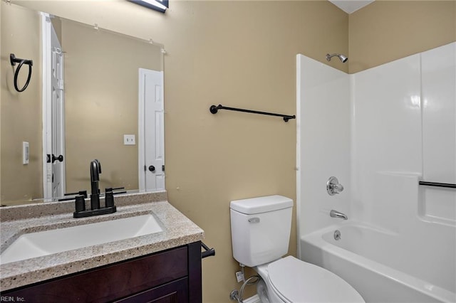 full bath featuring toilet, vanity, and bathtub / shower combination