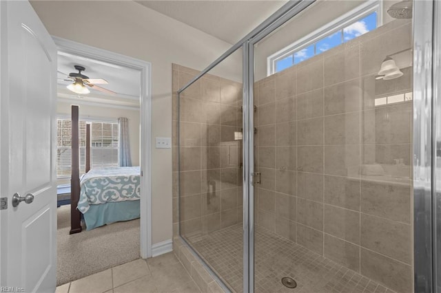 ensuite bathroom with tile patterned flooring, a stall shower, ensuite bath, and a ceiling fan