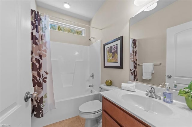 bathroom featuring tile patterned floors, toilet, vanity, and shower / bath combination with curtain