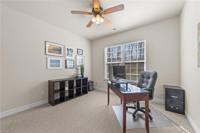 office area with visible vents, a ceiling fan, baseboards, and carpet floors