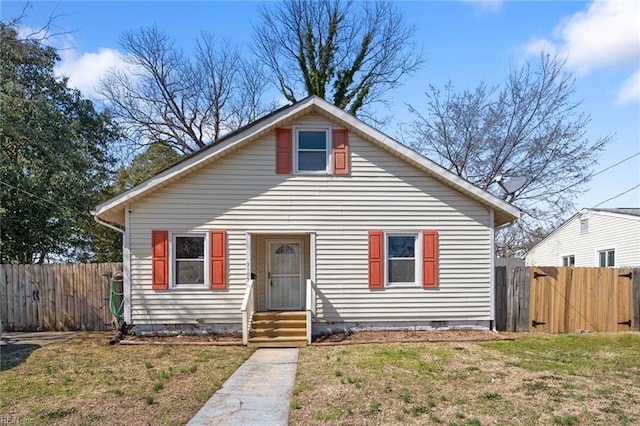 bungalow-style house featuring crawl space, a gate, a front lawn, and fence