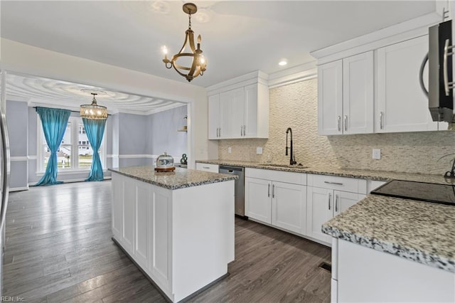 kitchen with dishwasher, white cabinets, a notable chandelier, and a sink