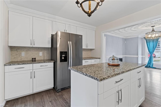 kitchen with dark wood-style floors, a notable chandelier, white cabinets, and stainless steel fridge with ice dispenser