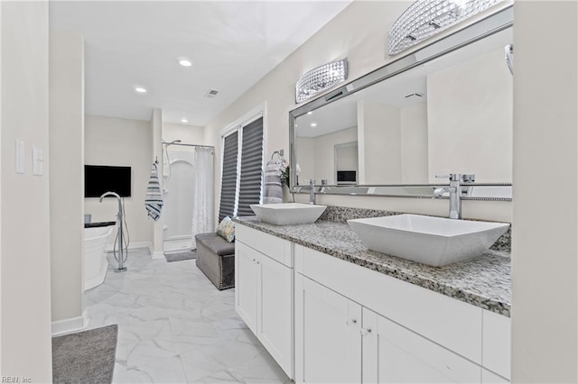 full bath with a shower stall, recessed lighting, marble finish floor, and a sink