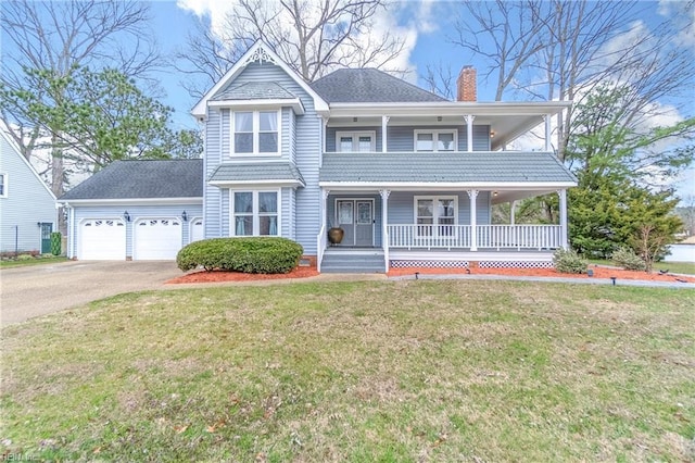 view of front of home with driveway, covered porch, an attached garage, a front yard, and a chimney