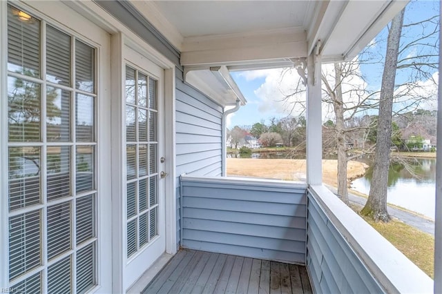 balcony featuring a water view