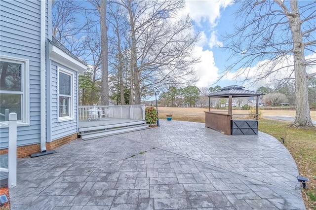 view of patio with a deck and a gazebo