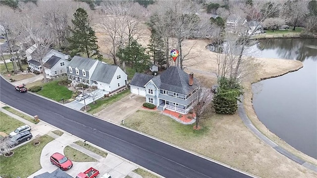 aerial view featuring a water view and a residential view