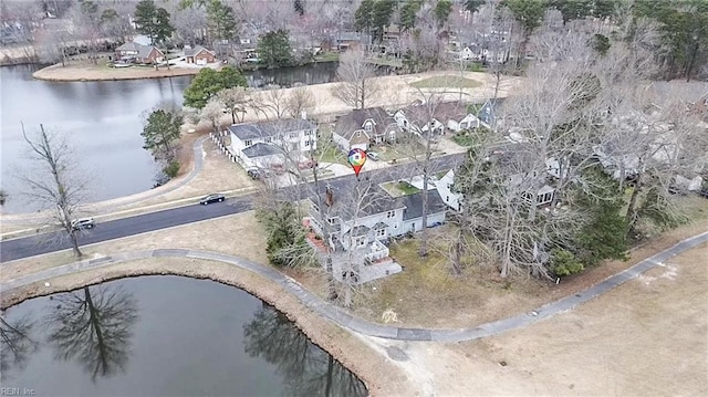 birds eye view of property with a residential view and a water view