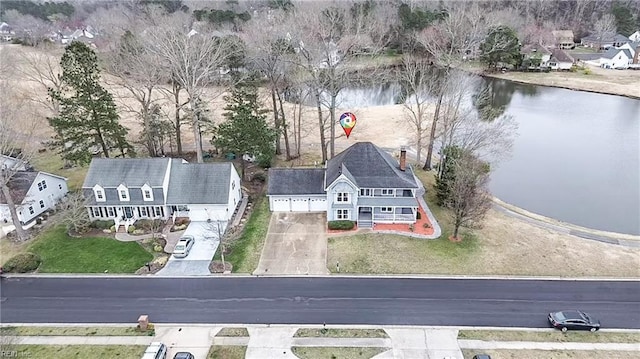 aerial view featuring a water view and a residential view