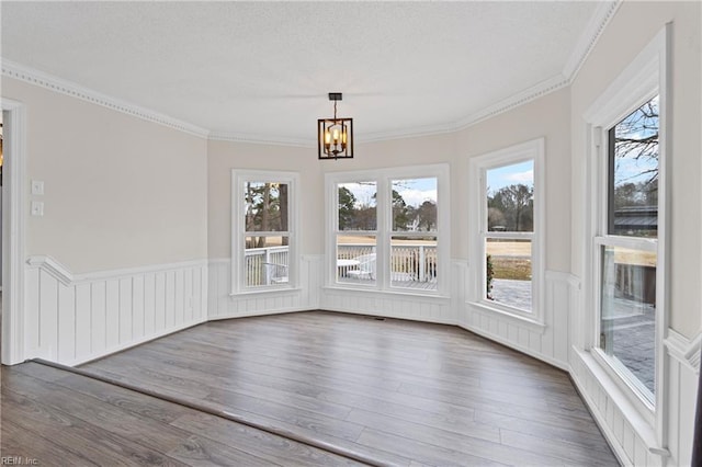 unfurnished sunroom with an inviting chandelier