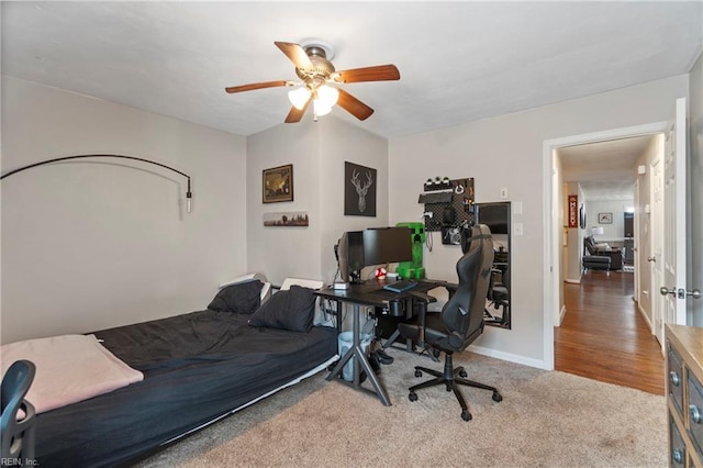 carpeted bedroom featuring baseboards