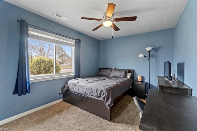 bedroom featuring visible vents, baseboards, carpet floors, and ceiling fan