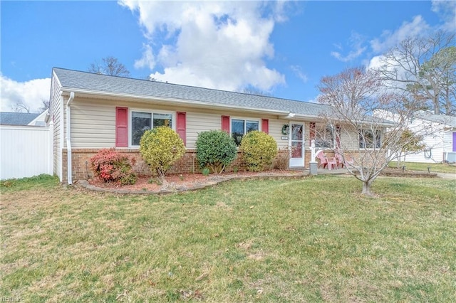 single story home featuring brick siding and a front lawn