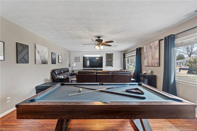 playroom featuring baseboards, ceiling fan, and wood finished floors