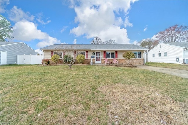 ranch-style home with brick siding, a porch, a front lawn, and fence