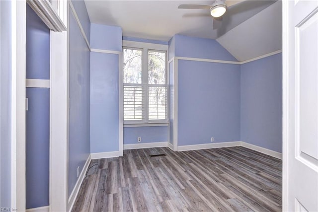 bonus room with ceiling fan, baseboards, lofted ceiling, and wood finished floors