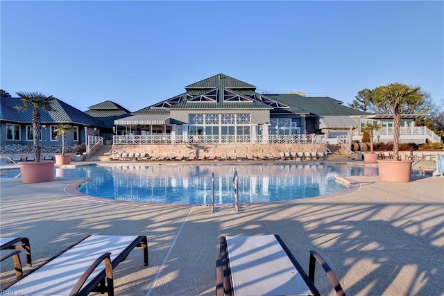 community pool featuring a patio area