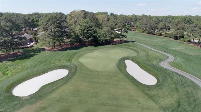 view of property's community featuring view of golf course