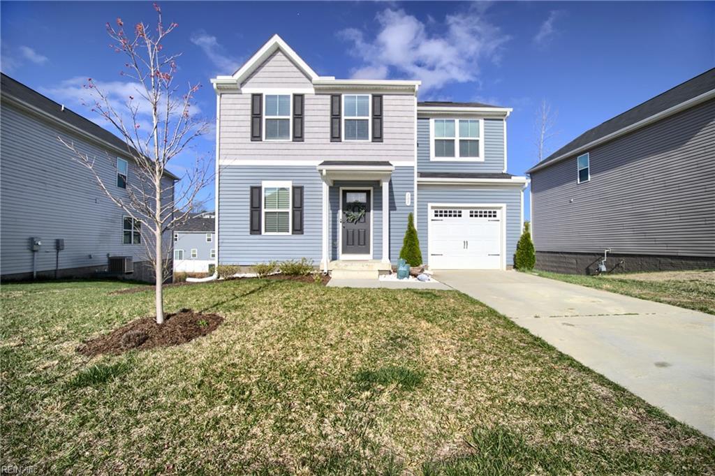 105 Lorraine Dr, Williamsburg, VA 23185 - traditional home featuring a garage, central air condition unit, a front lawn, and driveway