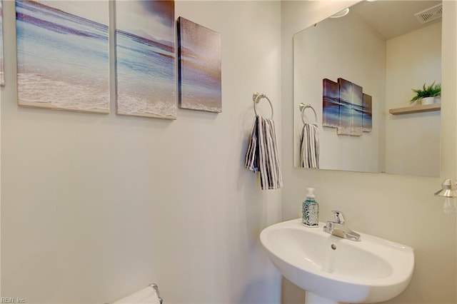 bathroom with a sink and visible vents