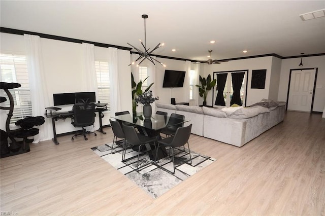 dining room with visible vents, recessed lighting, crown molding, light wood-type flooring, and a chandelier