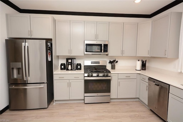 kitchen featuring light countertops, light wood-style floors, and appliances with stainless steel finishes