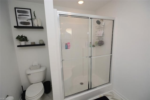 bathroom with recessed lighting, toilet, marble finish floor, and a shower stall