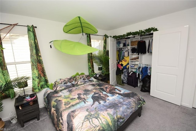 carpeted bedroom featuring a closet and multiple windows