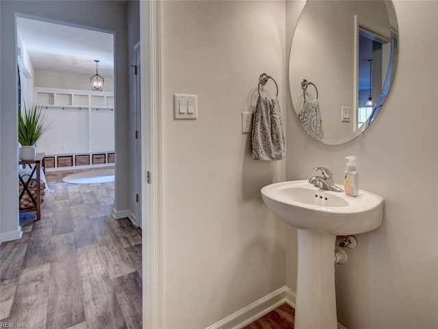 bathroom featuring baseboards and wood finished floors