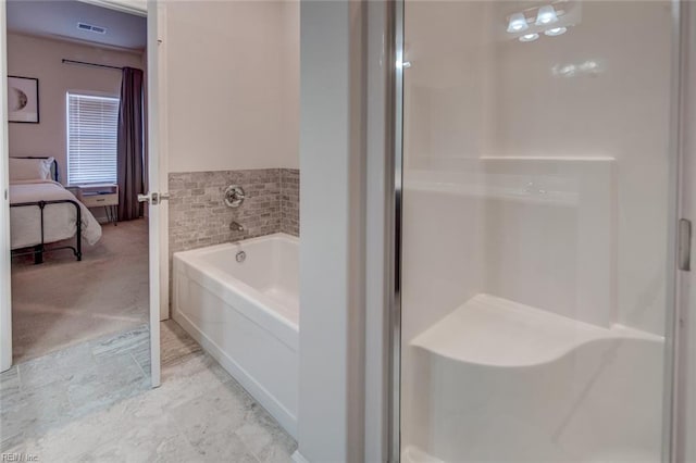 ensuite bathroom featuring a bath, visible vents, a shower stall, and connected bathroom