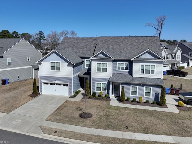 view of front of property featuring driveway, a front lawn, a residential view, roof with shingles, and an attached garage